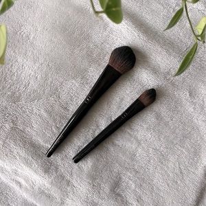 Two Laura Mercier makeup brushes